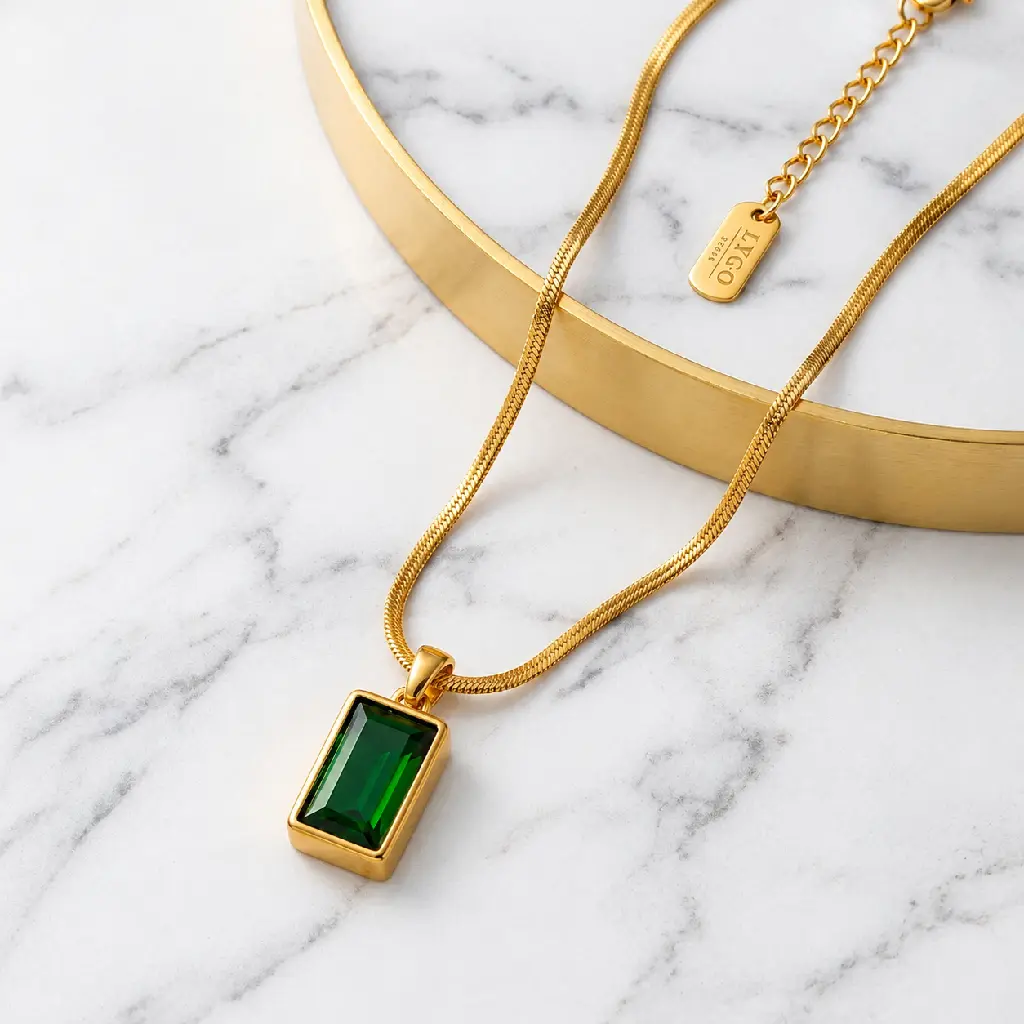 Emerald Pendant on Marble Display.webp