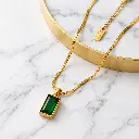 Emerald Pendant on Marble Display.webp