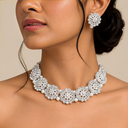 A silver-plated floral choker and matching stud earrings studded with white artificial stones